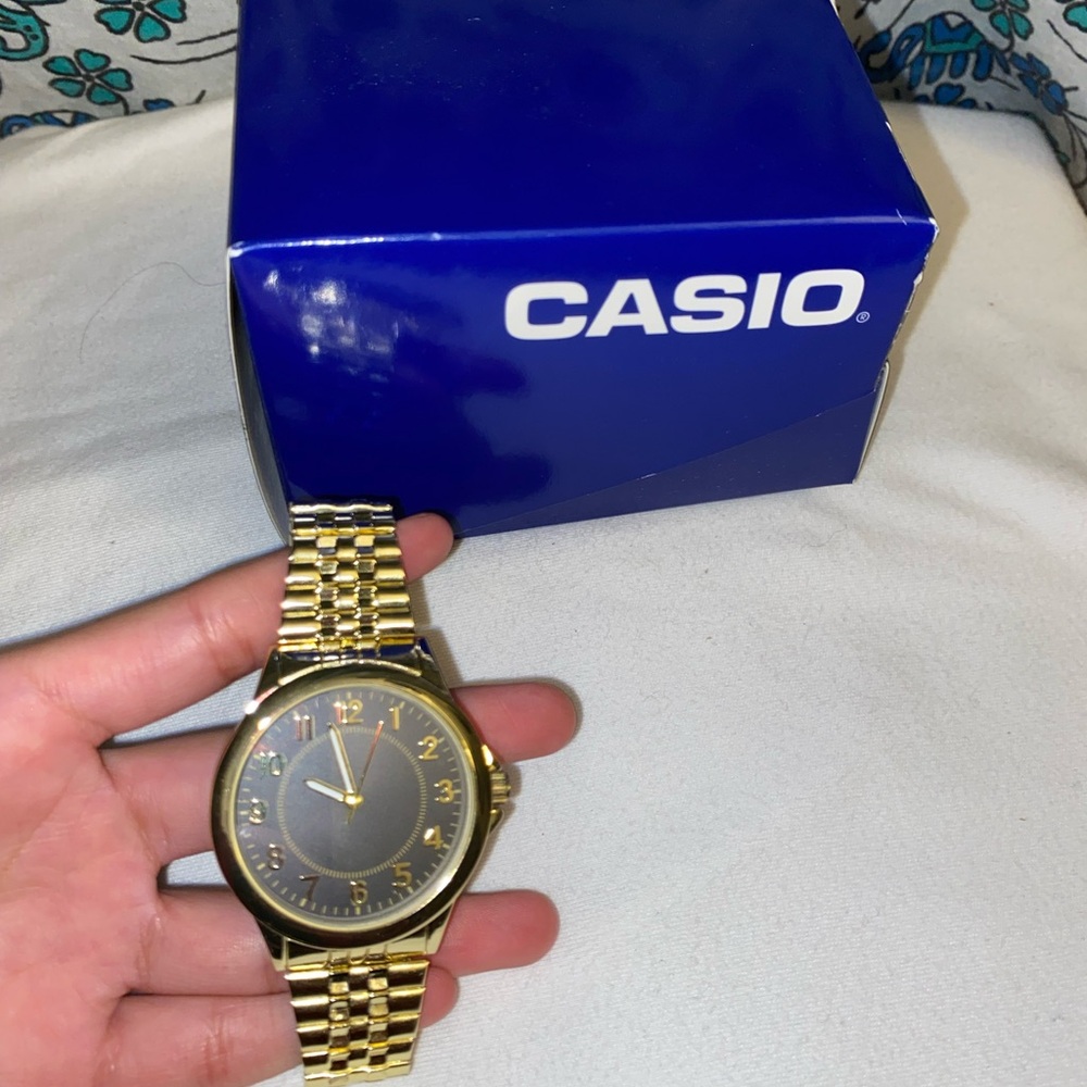 Casio Gold and Black Watch with Metal Band and Classic Design